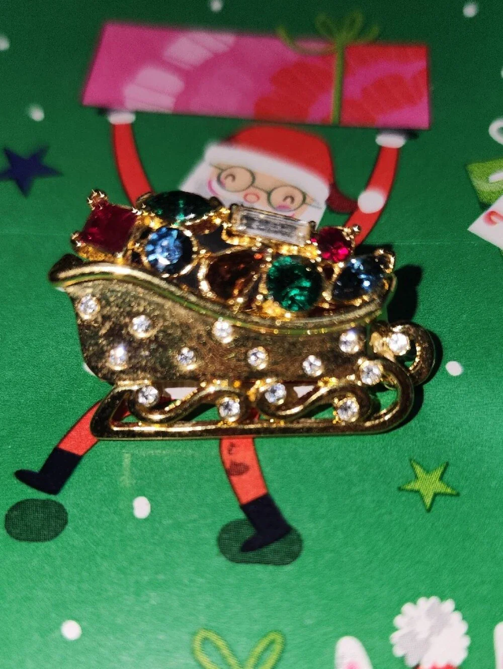 Monet Gold-tone Festive Sleigh Brooch with Multicolor Rhinestones